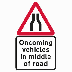 Oncoming vehicles in middle of road due to road narrowing sign