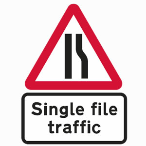 Single file traffic as road narrows on right sign