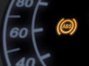 Anti-lock Braking System (ABS) warning light illuminating on car dashboard